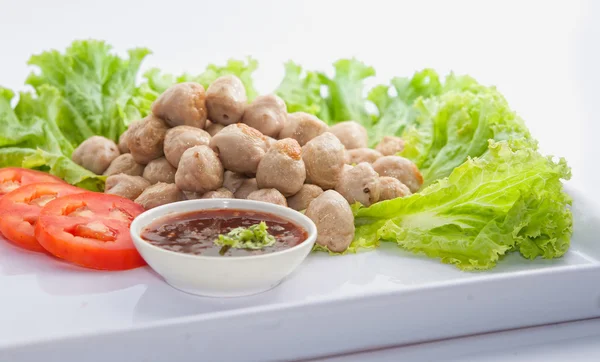 Fried meat ball on white dish