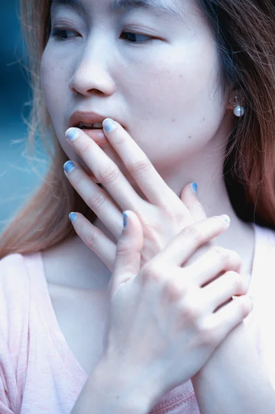 Close-up of beautiful face women and manicured fingers
