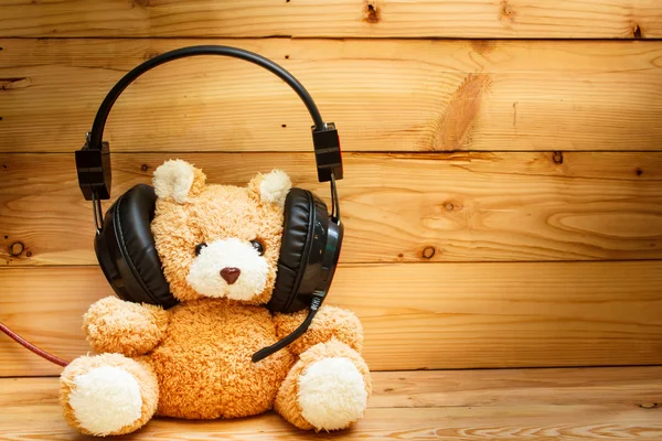 Teddy bear with headphones.