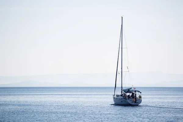 Sailing boat in the adriatic ocean, Croatia. Windless morning.