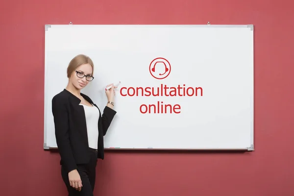 Girl writes consultation online on a white board.