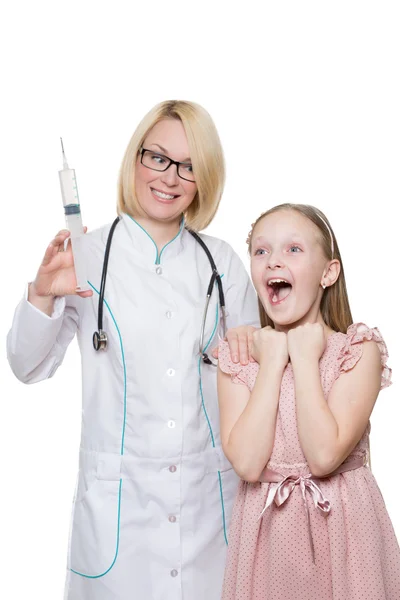 Mad Doctor doing vaccine injection to a child. huge syringe. Isolated white background