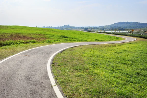 Outdoor asphalt road, exercise bike paths on the hill