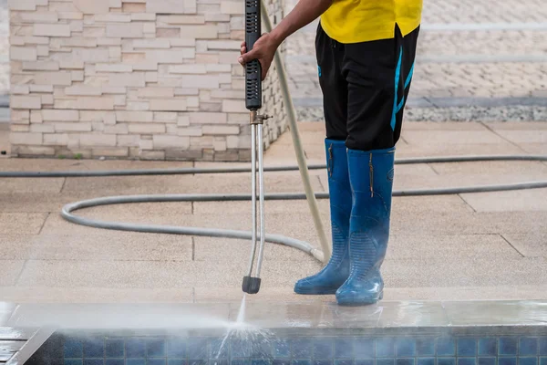 Close up Outdoor floor cleaning with high pressure water jet