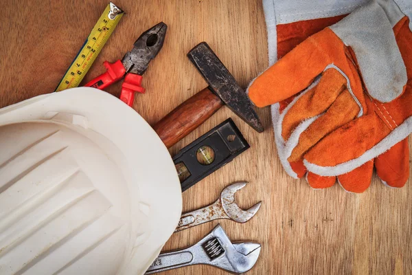 Closeup of assorted work tools on wood