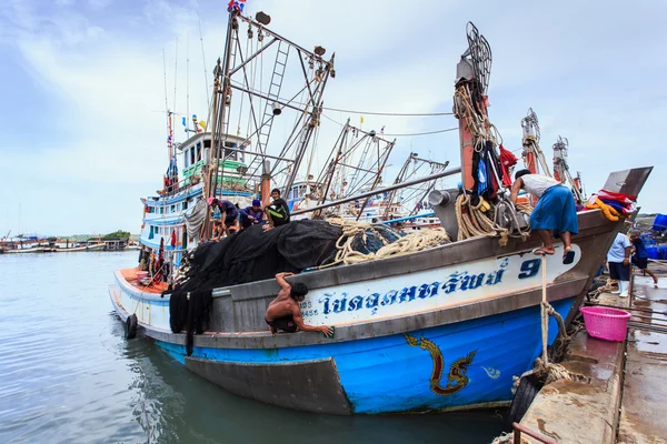 Fishing boats stand in the harbor To transport fish from the boat to the market which 100 percentage of labor on boat is Burmese on July 27, 2014 in Phuket, Thailand