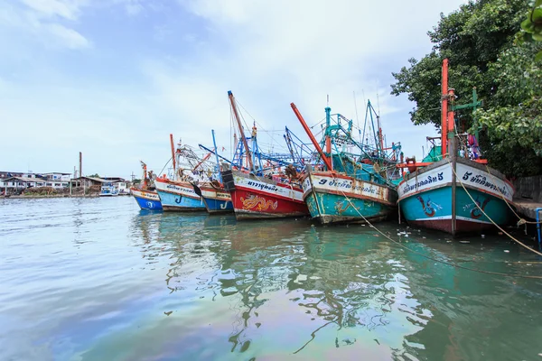 Fishing boats stand in the harbor To transport fish from the boat to the market which 100 percentage of labor on boat is Burmese on July 27, 2014 in Phuket, Thailand