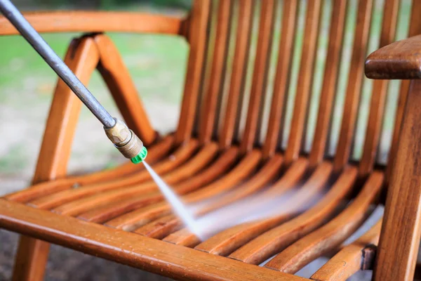 Wooden chair cleaning with high pressure water jet