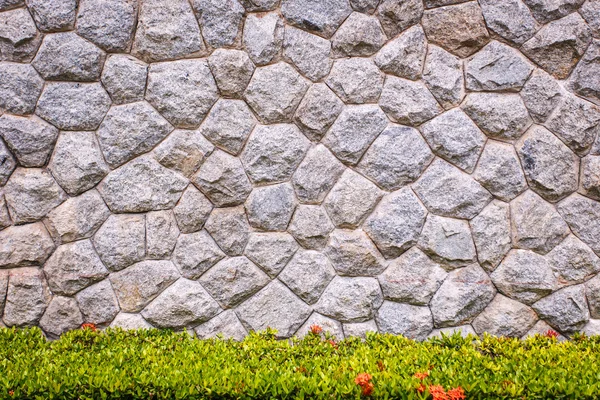 Granite stone wall and decorative garden