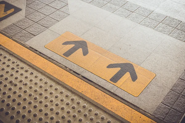 Arrows signs on floor