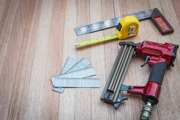 Air nail gun with measurement tools