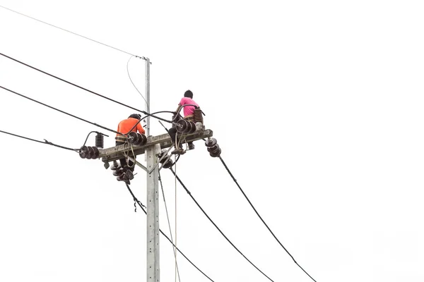 Thai worker on electric pole for install new cable isolated on w