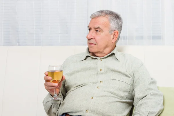 Old man drinking wine