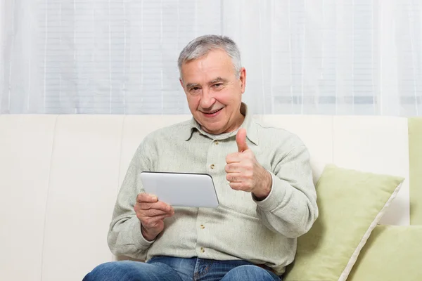 Old man with digital tablet