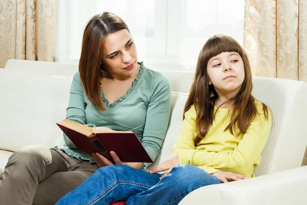 Mother and daughter with book