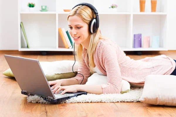 Woman with headphones enjoys music