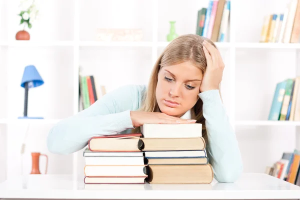 Young female student is sad because she has to learning