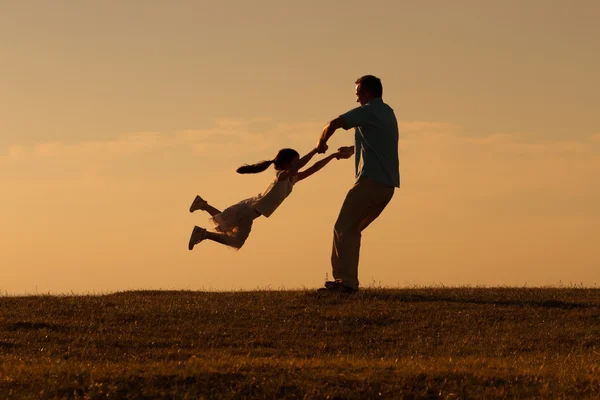 Happy father with girl in nature
