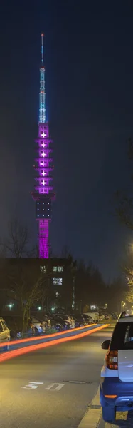 Hannover, Germany - March 18, 2015: Telecommunication tower Telemax in Hannover. The tower is illuminated in magenta, the corporate color of Deutsche Telekom, for the CeBit.