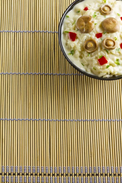 Saffron Milk Cap mushroom rice with white wine sauce on a bamboo