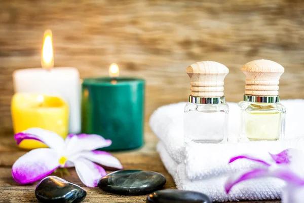 Spa massage setting, bottle of aroma essential oil.