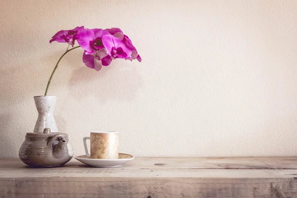 Teapot and flower, home decoration concept