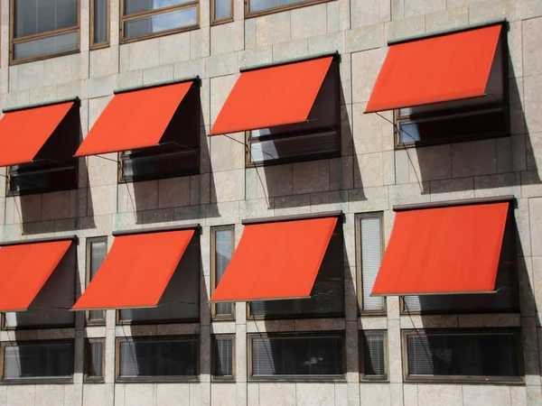 Perspective view on Modern Building with Red Sunshades