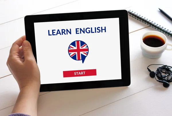 Hand holding tablet with online learn English concept on screen