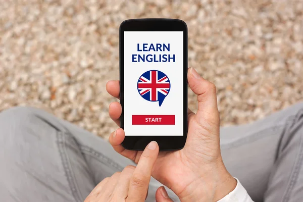 Hands holding smartphone with online learn English concept on sc