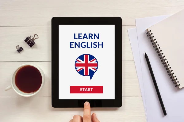 Online learn English concept on tablet screen with office object