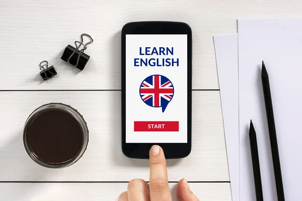 Online learn English concept on smartphone screen with office ob