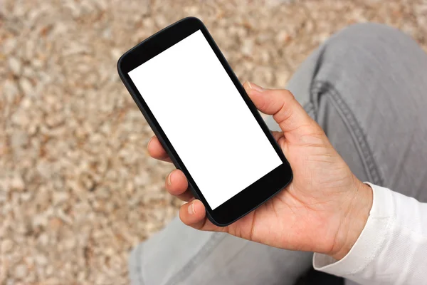 Close up view of smart phone with white blank empty screen