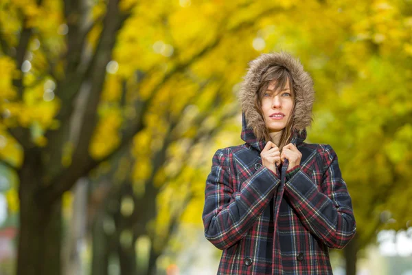 Sad woman in autumn scenery