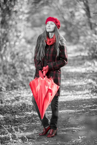 Autumn woman with red umbrella