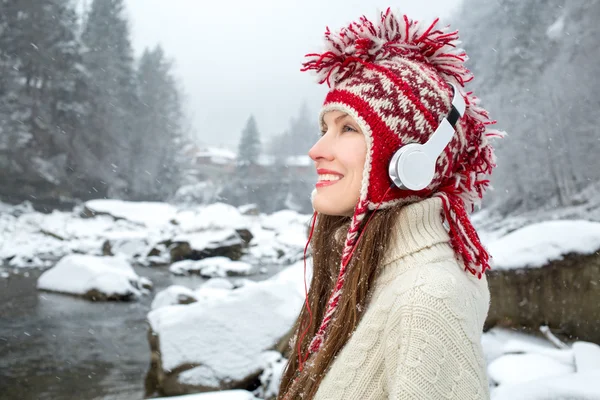 Winter girl listening to music
