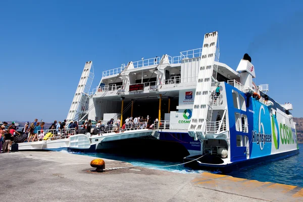 Tourists arriving to Santorini\'s port on board Seats catamaran super ferry