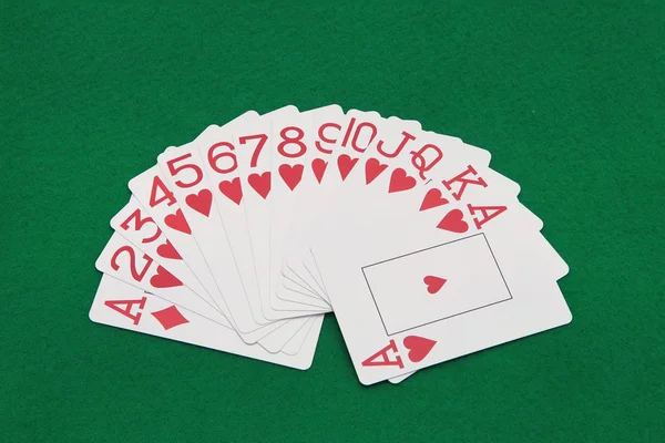 Cards on green casino table