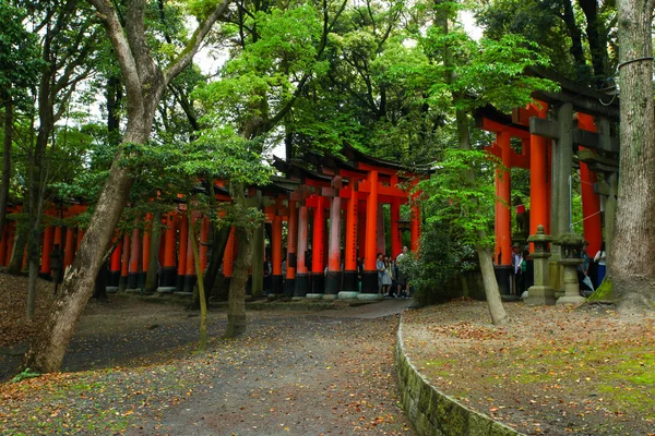 Japanese people and tourists at Fushimi Inari Shrine in Kyoto