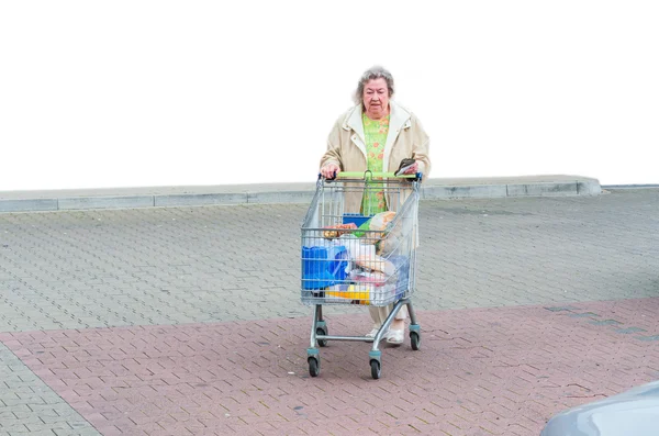 Mature woman with shopping cart