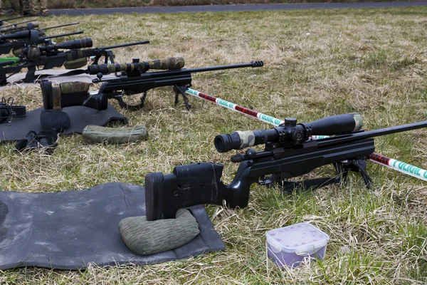 Military sniper aims at a target