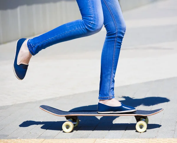 Woman skateboard, legs close up