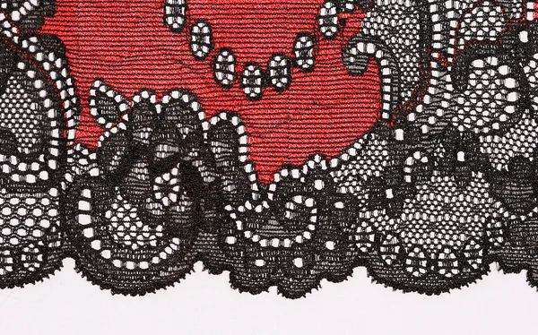 The macro shot of the red and black lace texture materia