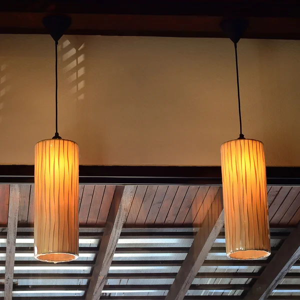 Beautiful warm lamps against interia design in a coffee shop