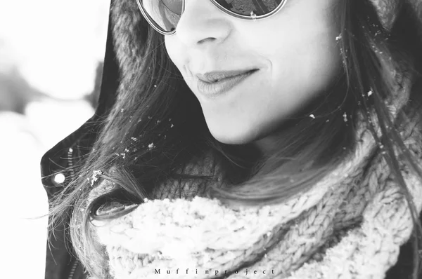 Girl enjoy snow and sunshine in winter