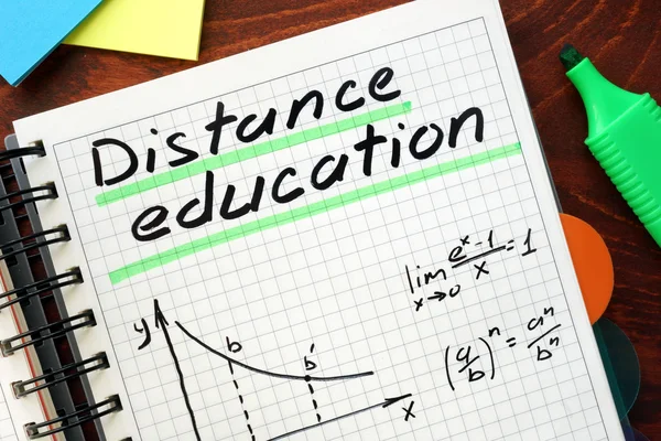 Distance education written in a notebook.