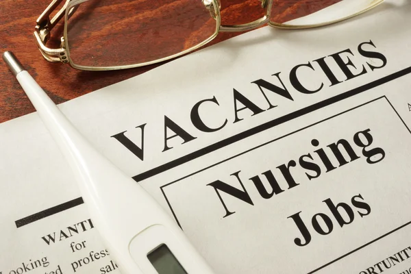 Newspaper with ads nursing jobs vacancy.