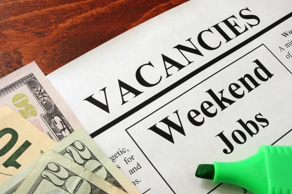 Newspaper with ads weekend jobs vacancy.
