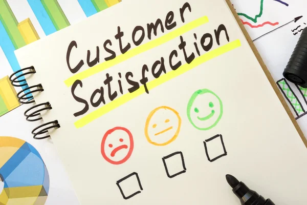 Sign customer satisfaction on a page of notebook.