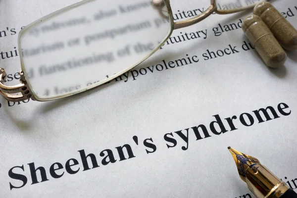 Paper with words Sheehan syndrome  and glasses. Medical concept.