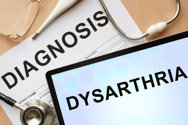 Tablet with diagnosis dysarthria and stethoscope.